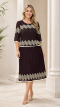 Chocolate brown geometric pleated midi dress shown from the front