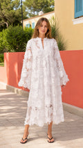 Front full view of woman wearing white floral lace midi dress