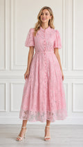Front view of model wearing pink floral embroidered midi dress