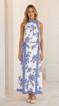 Full front view of model wearing white floral print sleeveless maxi dress