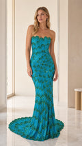 Front view of model wearing teal sequin strapless mermaid gown