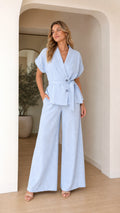 Front view of model wearing light blue two-piece blazer and wide leg pants set