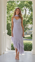 Front view of model wearing lavender floral applique ruffle evening dress with neck scarf
