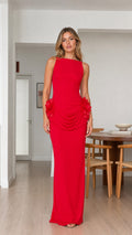 Front view of model wearing sleeveless red maxi dress with 3D floral hip detail