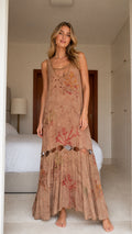 Model wearing brown boho floral print cutout maxi dress, front view