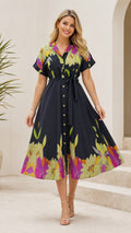 Front view of black floral border print midi shirt dress with belted waist