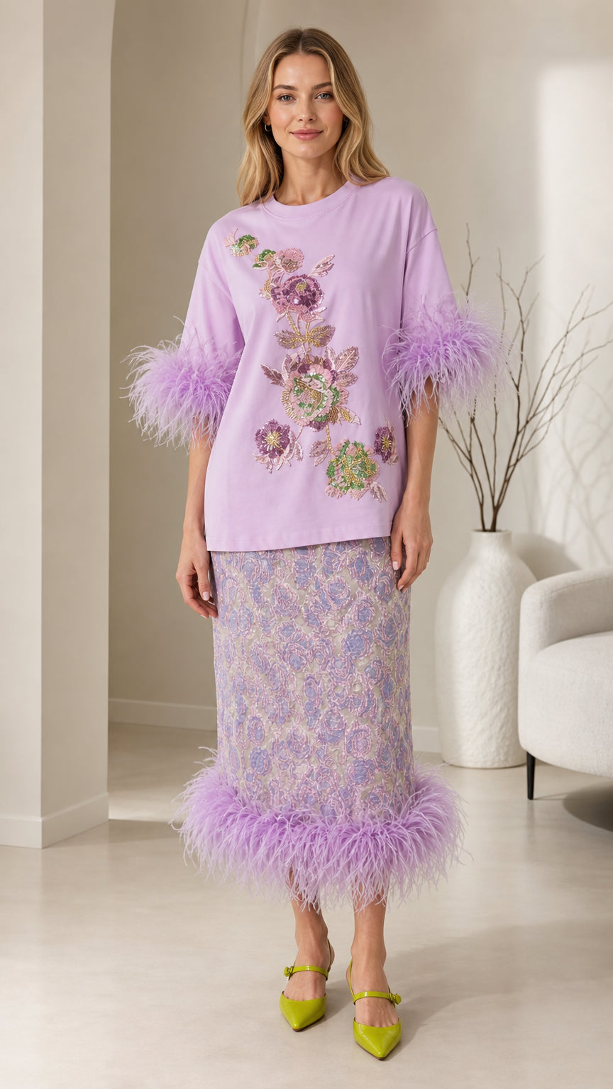 Front view of model wearing lavender feather trim top and midi skirt co-ord set