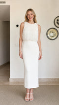 Model wearing white fringe textured sleeveless midi dress, front view