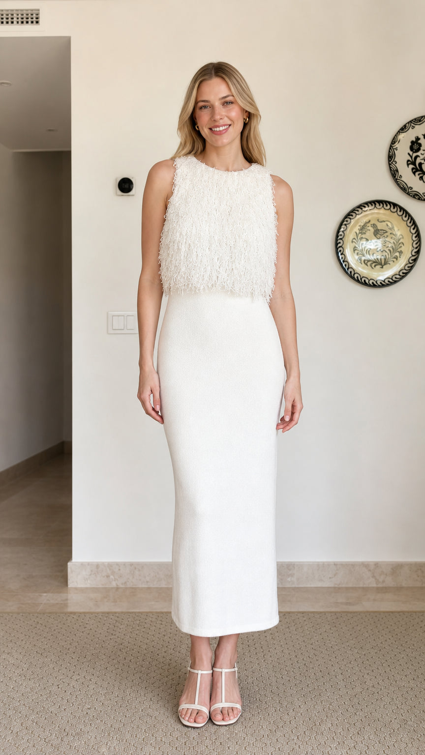 Model wearing white fringe textured sleeveless midi dress, front view
