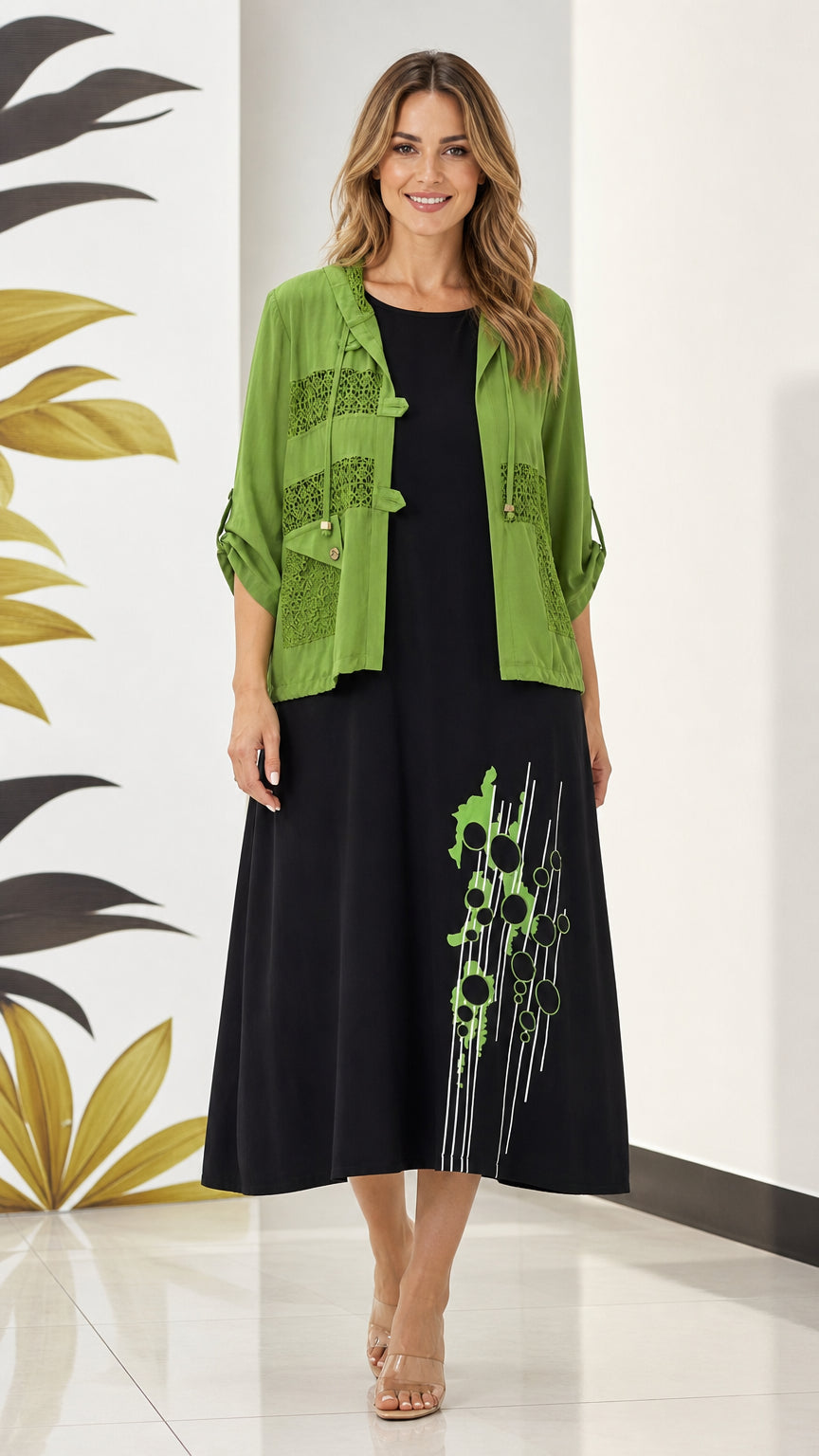Full front view of model wearing olive green hooded lace jacket and black graphic midi dress set