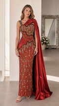 Front view of red beaded evening gown with cape