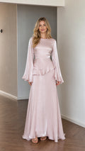 Front view of model wearing pink satin long sleeve maxi dress