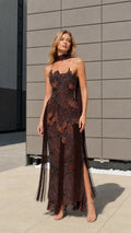 Model wearing brown beaded halter fringe evening gown from the front