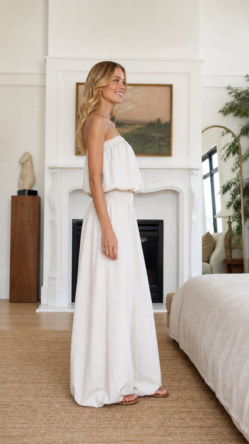 Side profile view of model in beige two-piece set