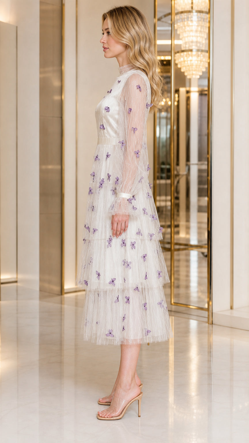 Side profile view of ivory white 3D butterfly tiered tulle midi dress