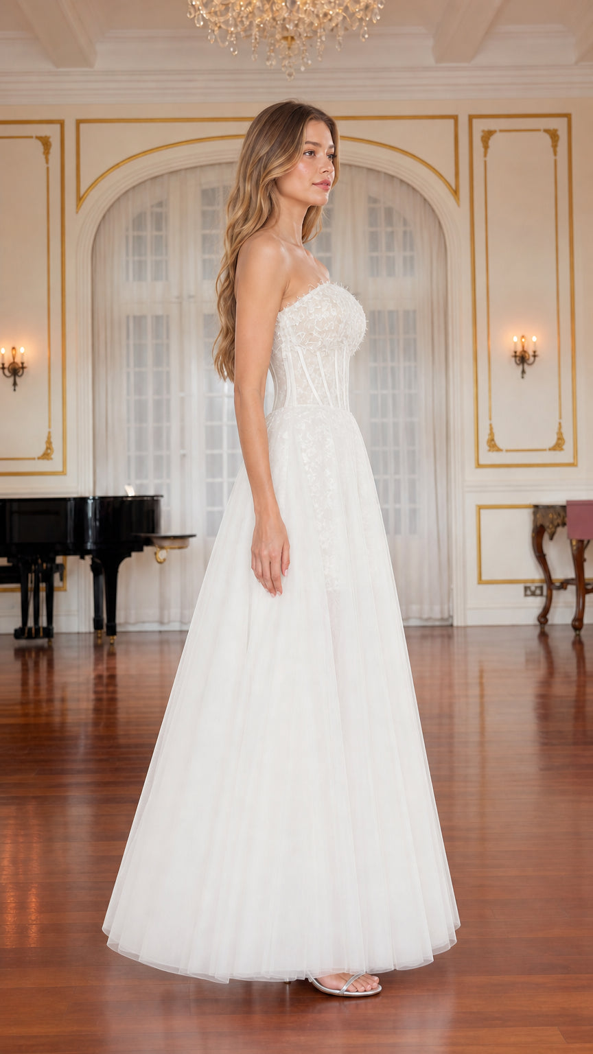 Side profile view of white strapless lace corset evening gown