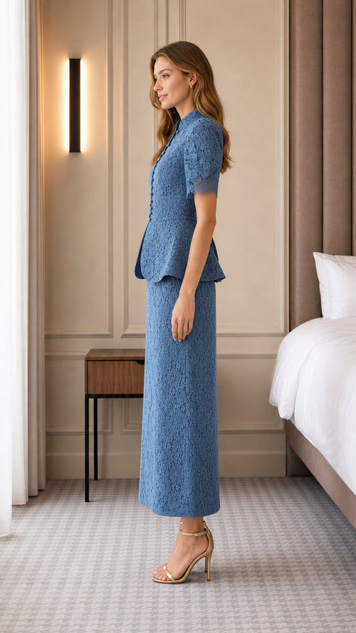 Side profile of woman in blue lace peplum skirt set