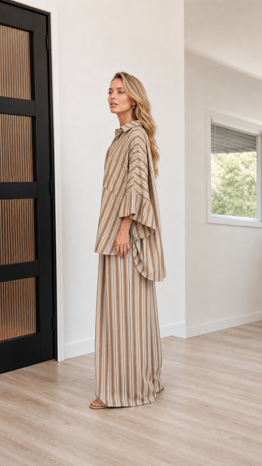 Side profile view of camel striped two-piece set