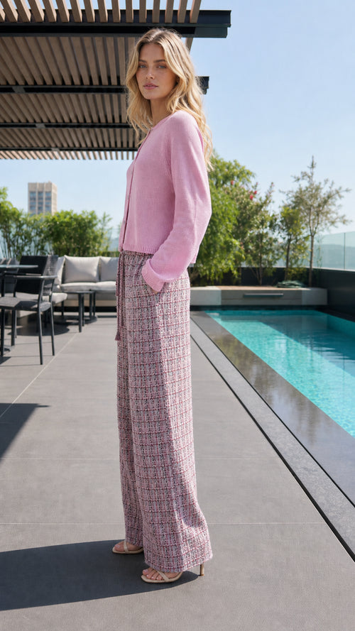Side profile of model in pink lounge set