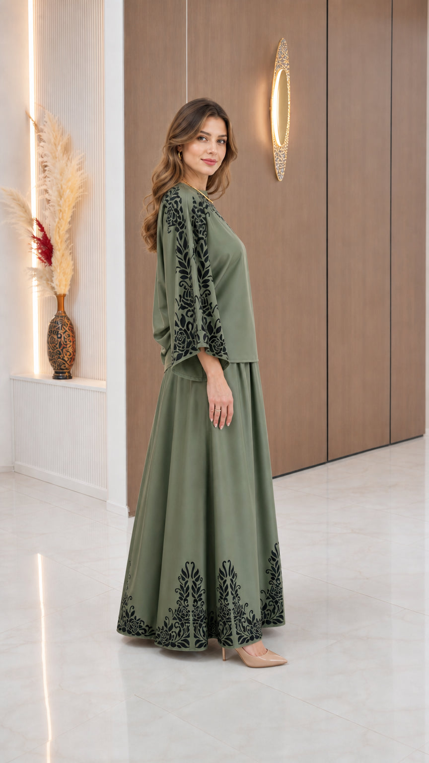 Side profile of model wearing Sage Green two-piece skirt set with wide bell sleeves
