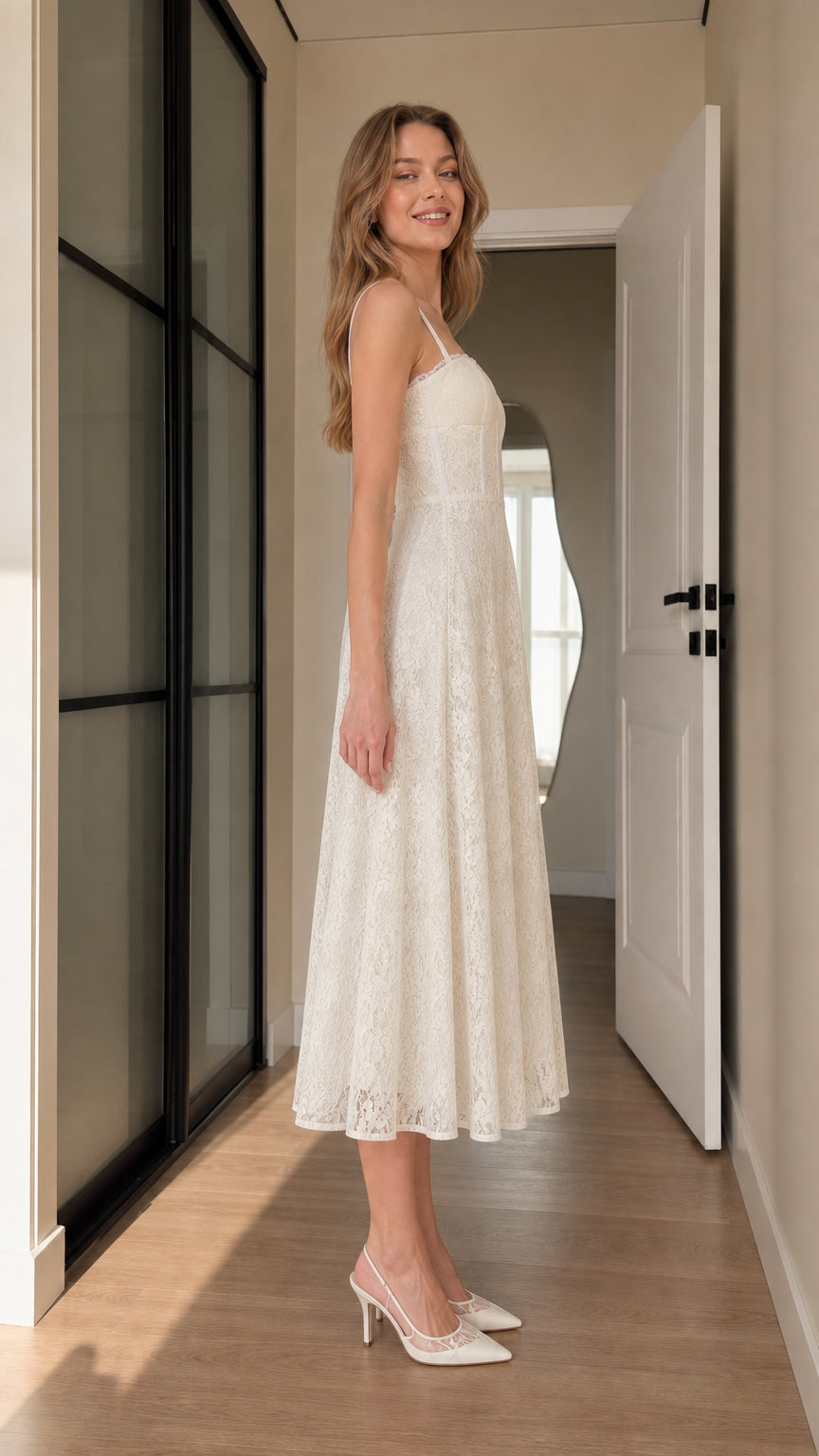 Side profile view of ivory lace A-line corset midi dress