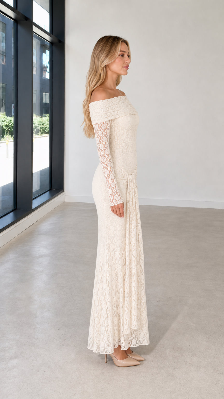 Side profile view of ivory lace evening dress