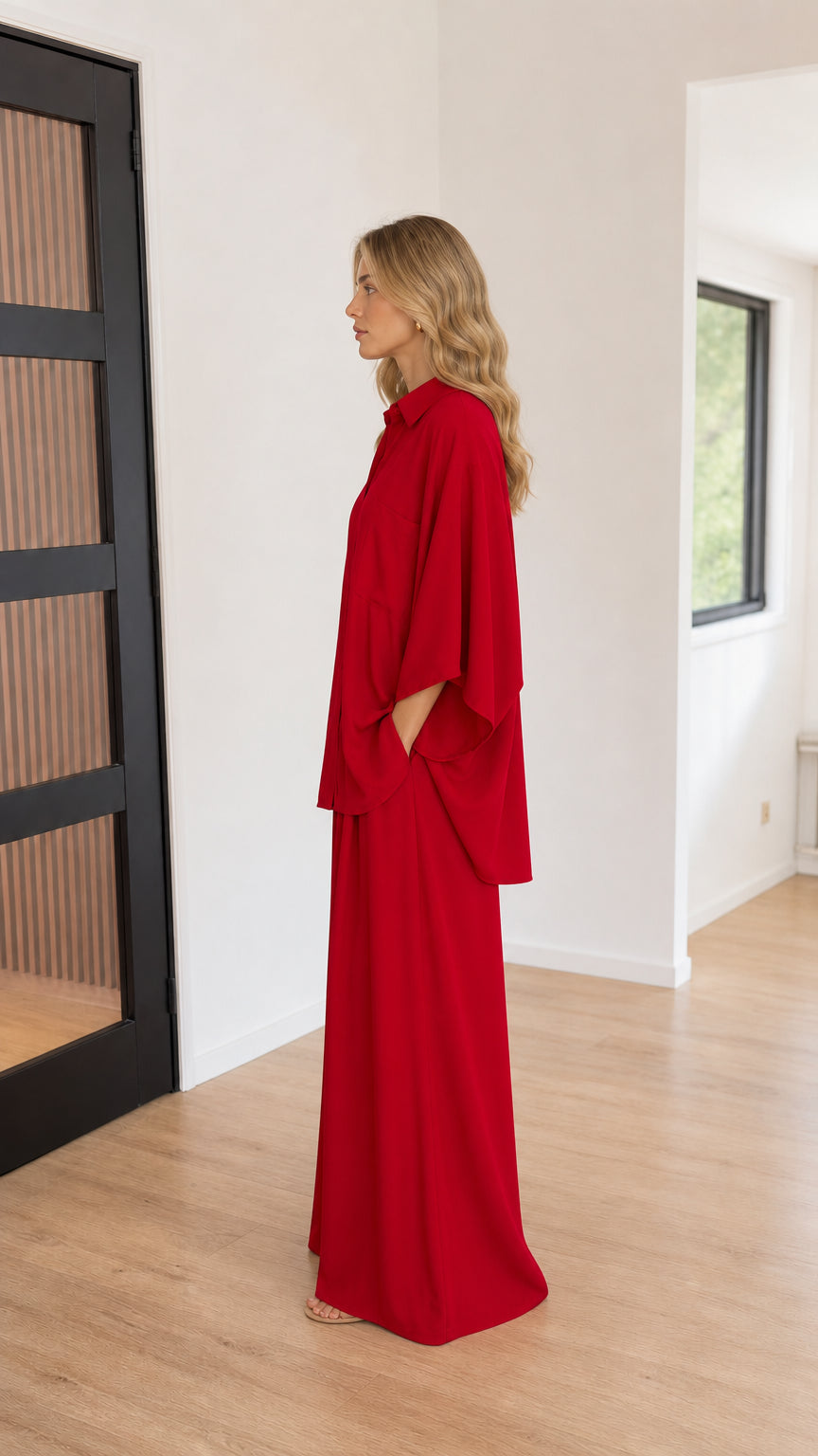 Red relaxed two-piece pants set shown from the side