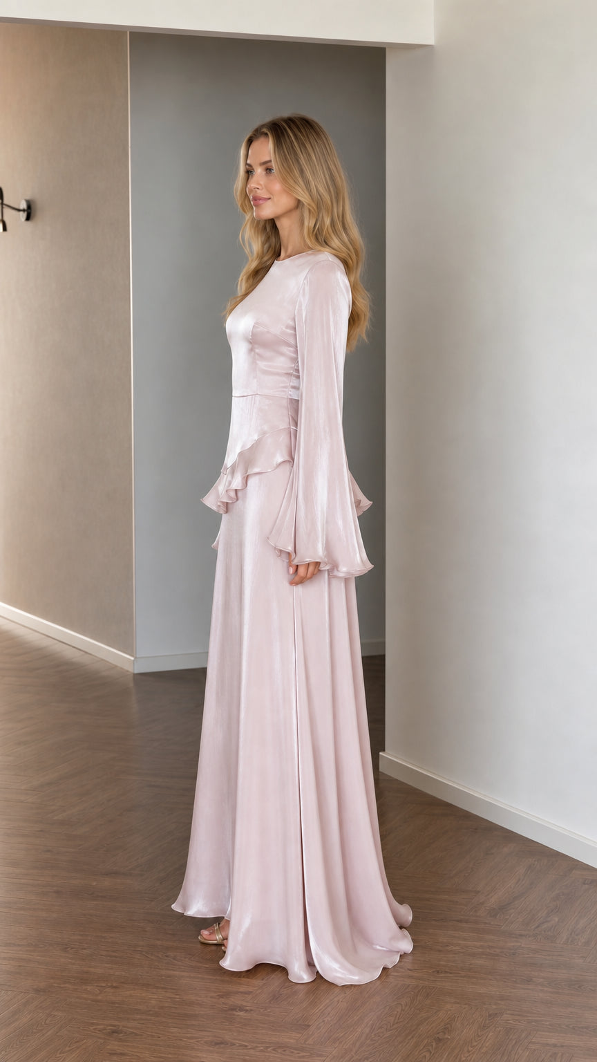 Side profile of model in pink satin maxi dress