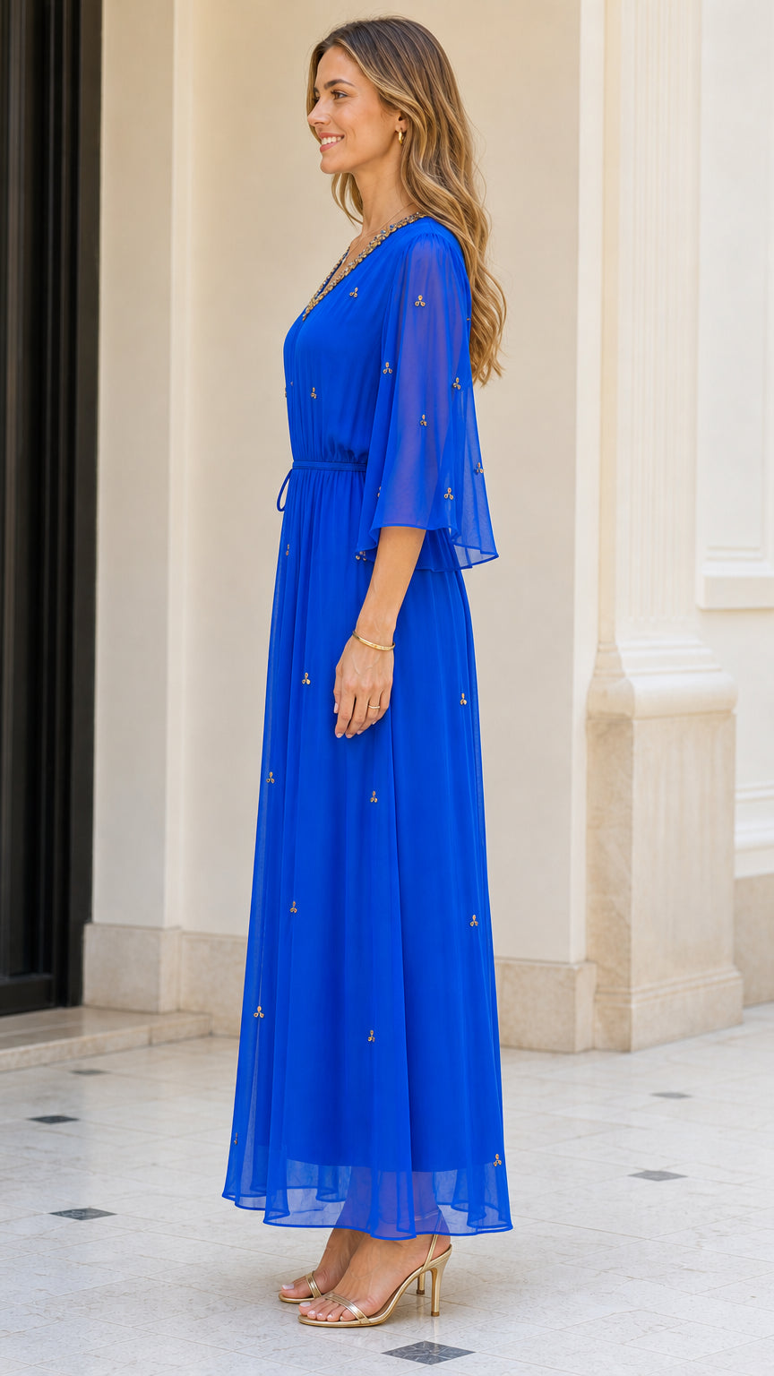 Side profile view of model in Royal Blue maxi dress