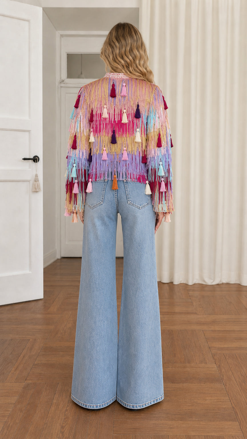 Back view of model showing full multi-color fringe and tassel tier layout
