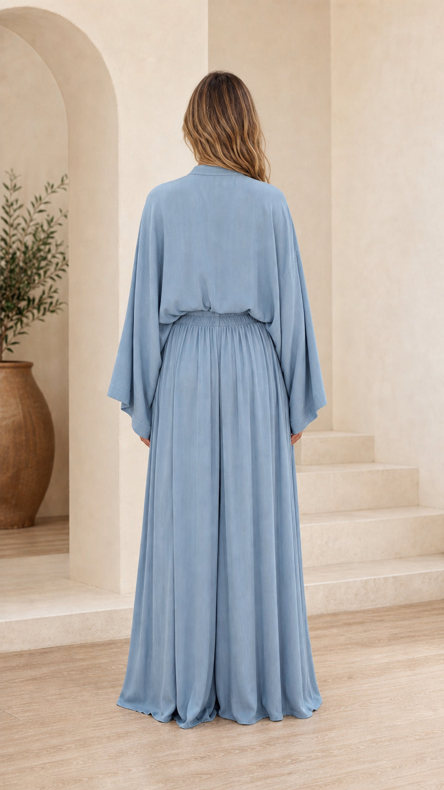 Back view of light blue set showing draped sleeves