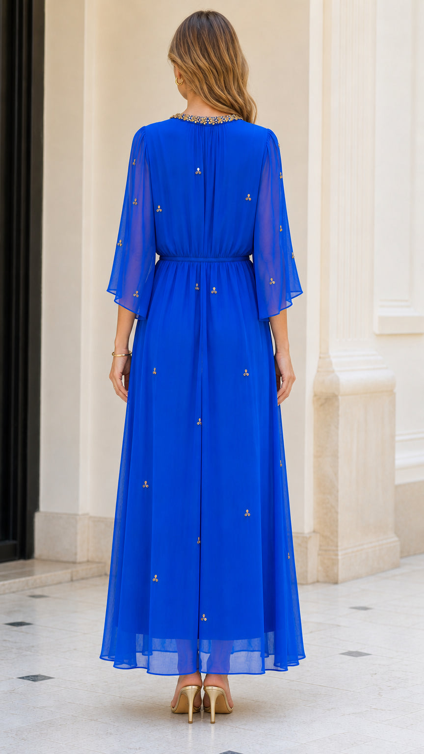 Back view of model showcasing flowing Royal Blue chiffon dress