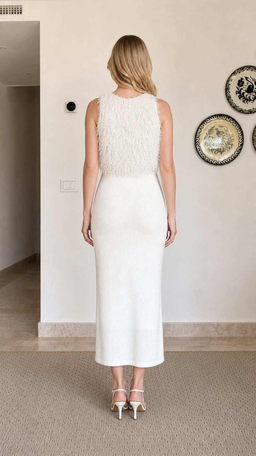 Model wearing white fringe textured sleeveless midi dress, back view