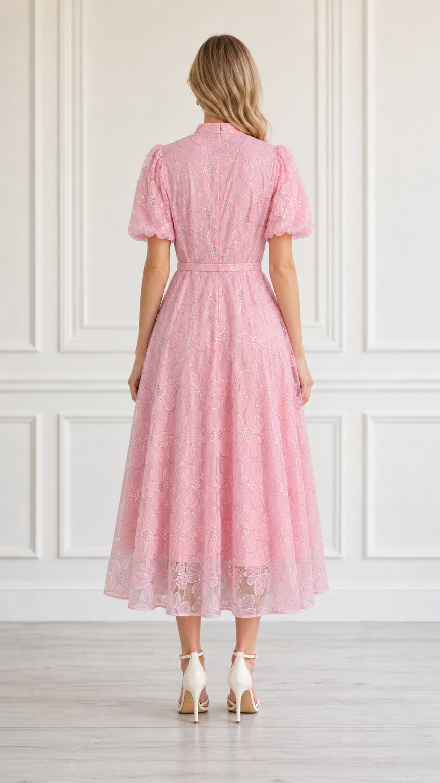 Back view of model in pink midi dress