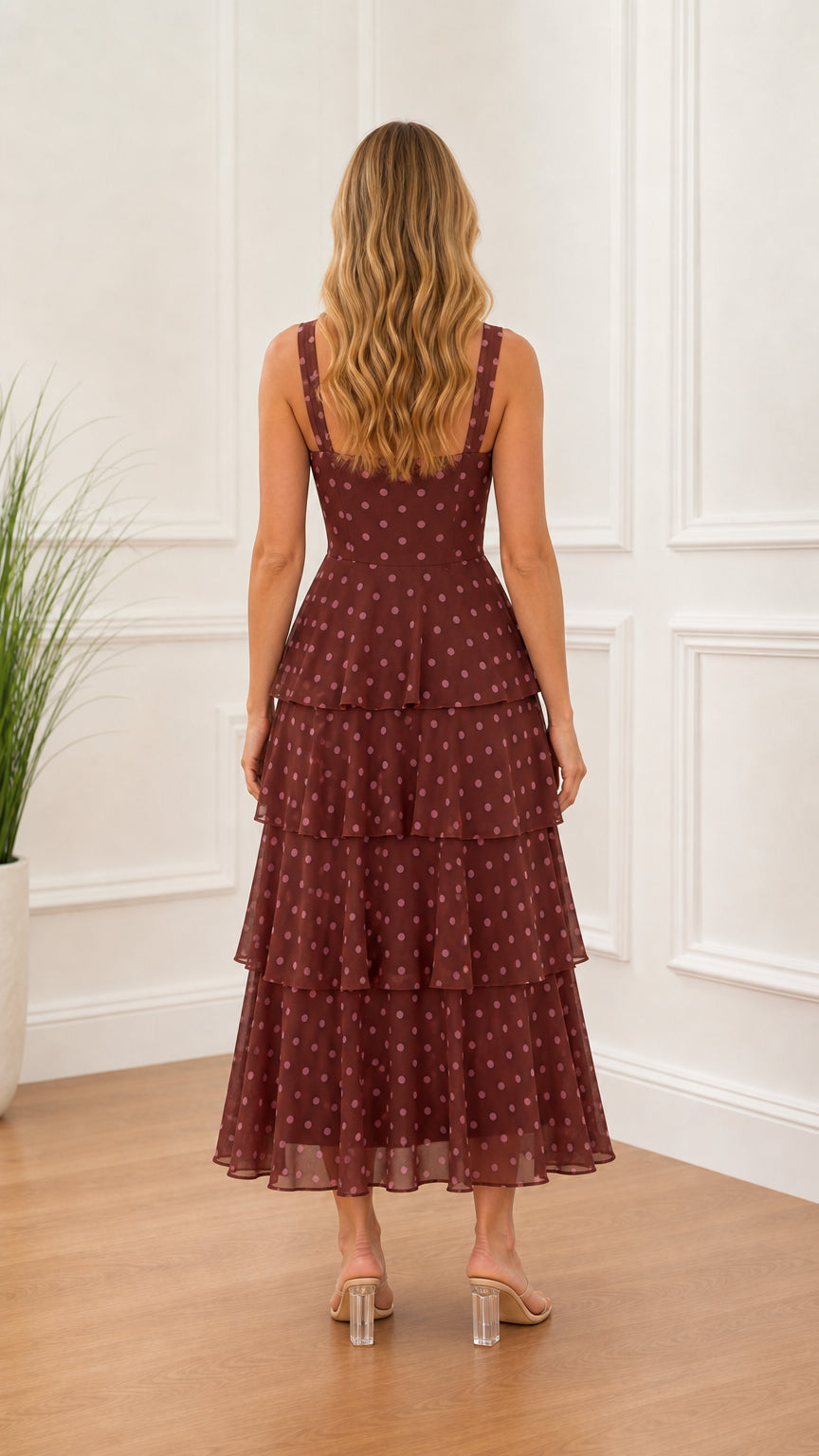 Back view of model wearing burgundy polka dot midi dress