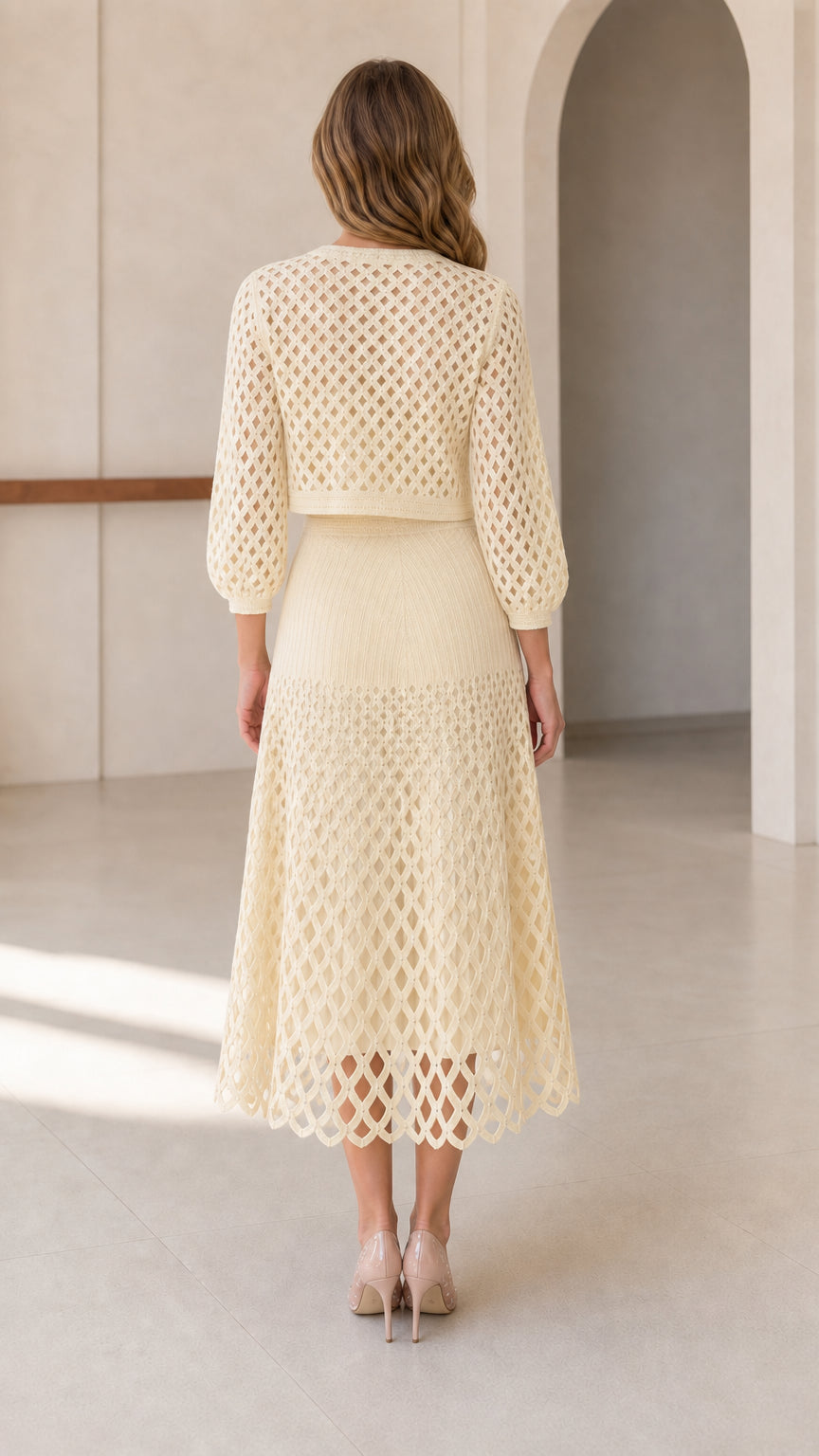 Back view of model wearing cream knit matching set