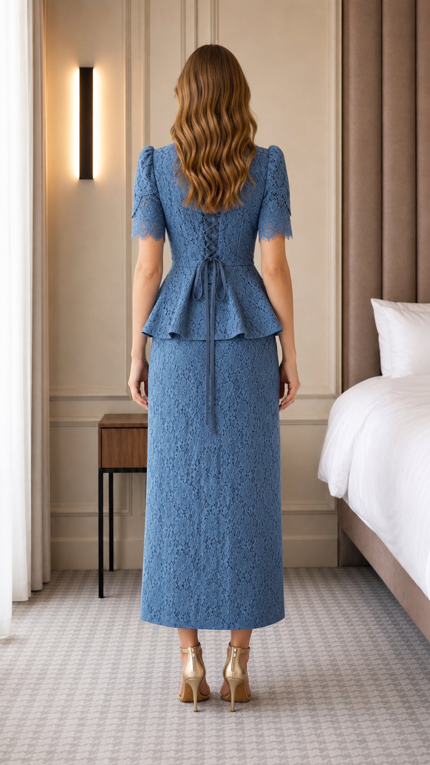 Back view of woman showing lace-up detail on blue lace outfit