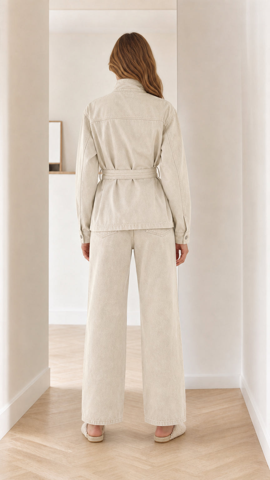 Back view of beige utility jacket and trousers