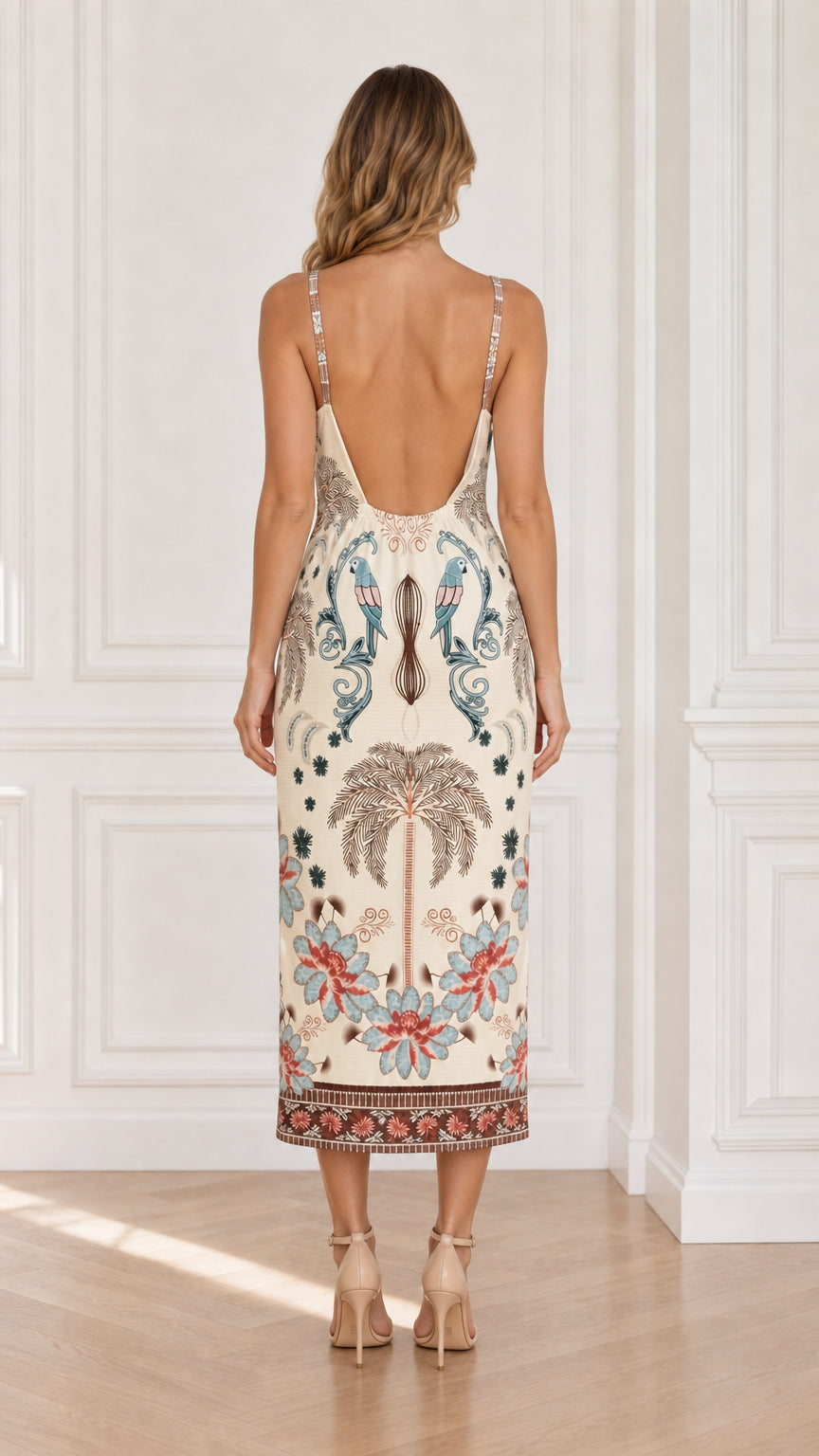 Back view of model wearing Ivory tropical parrot print camisole midi dress