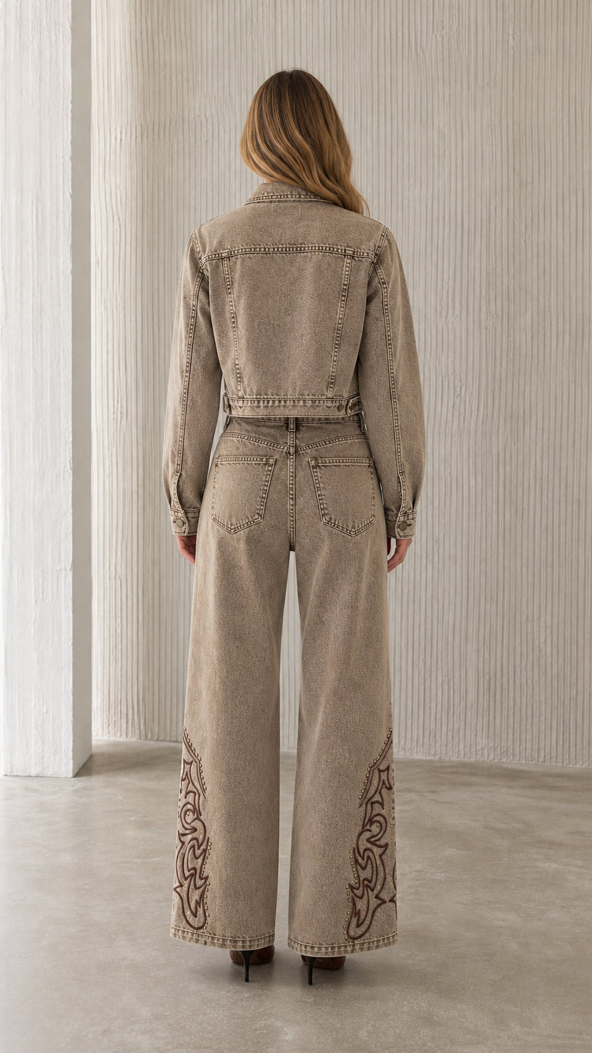 Back view of model in khaki embroidered denim set