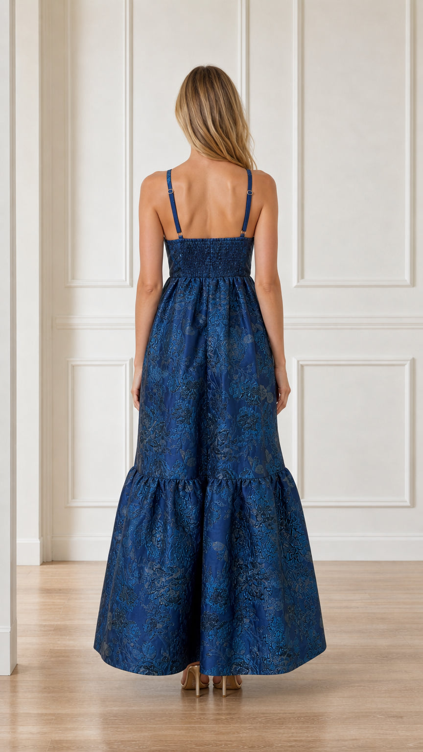 Back view showing smocked bodice and straps on blue maxi dress