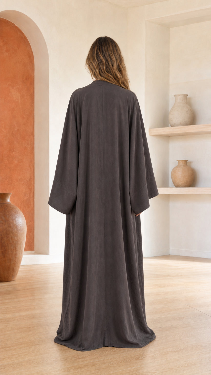Back view of woman in dark grey maxi dress