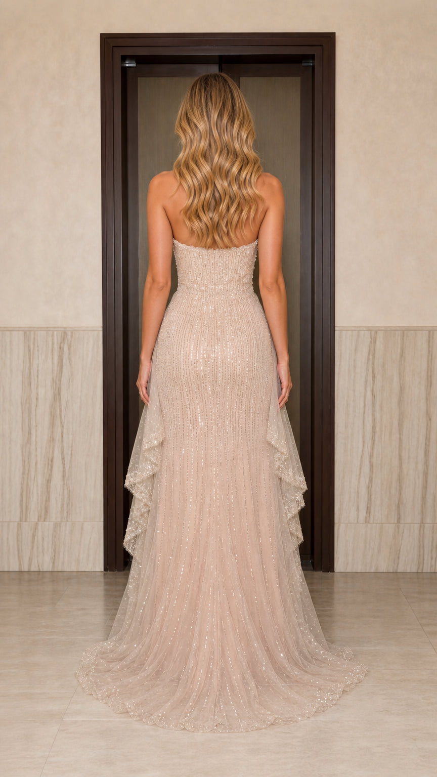 Back view of champagne sequin formal dress showing train