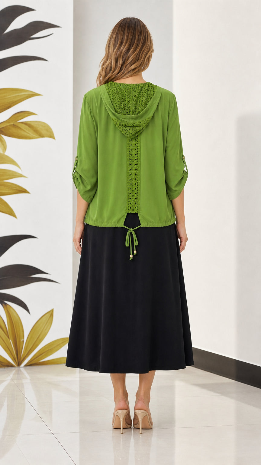 Back view of olive green hooded jacket featuring crochet lace stripe and cinched tie detail