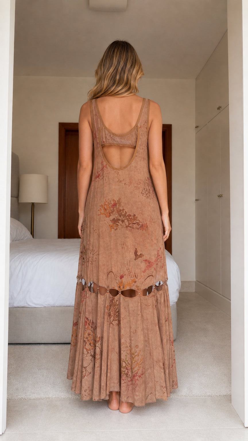 Model wearing brown boho floral print cutout maxi dress, back view