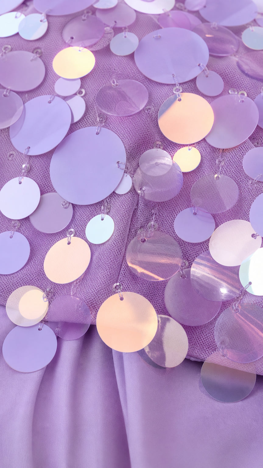 Close up of iridescent oversized sequins on bodice