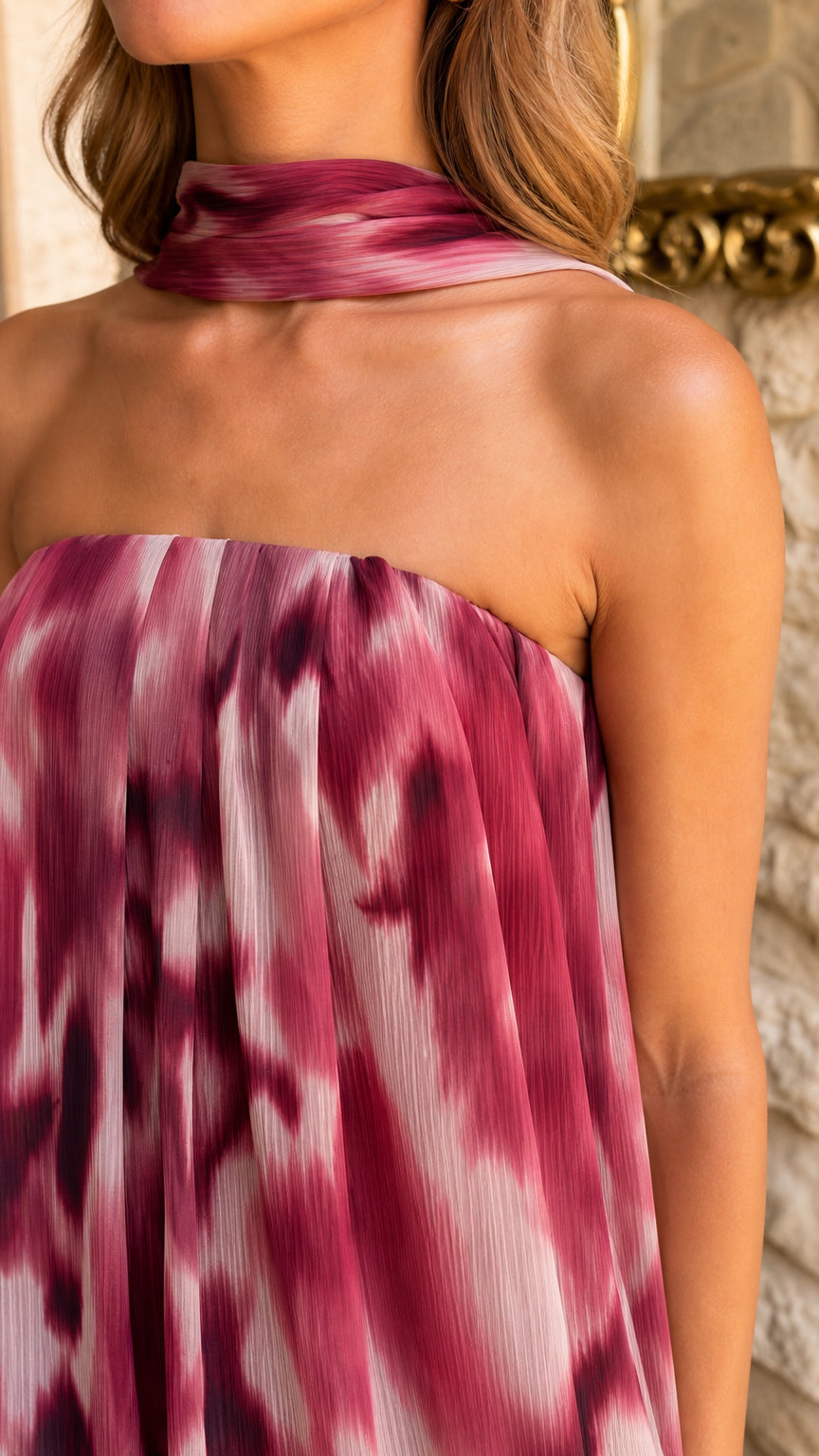Close-up of rose wine tie-dye pleated fabric and neck scarf