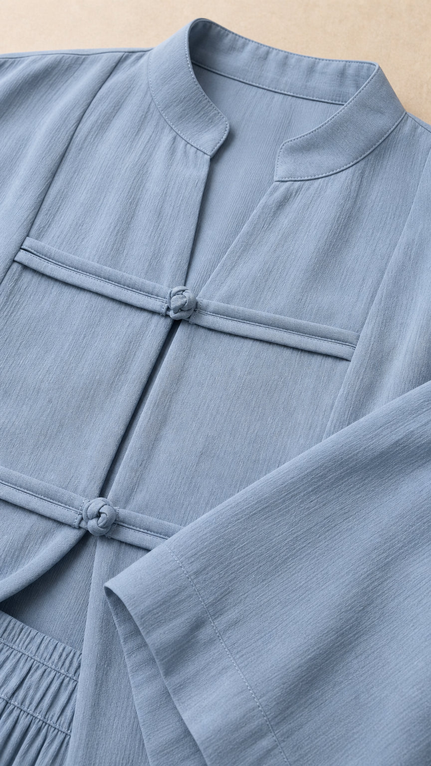 Close-up detail of Mandarin collar and frog button closures