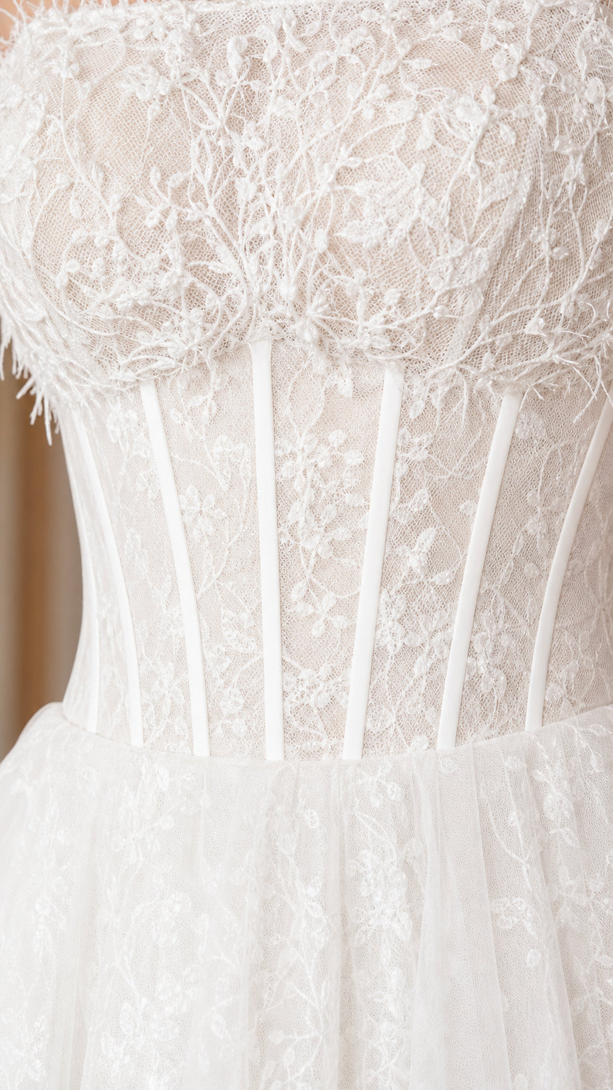 Close-up detail of lace embroidery and vertical corset boning