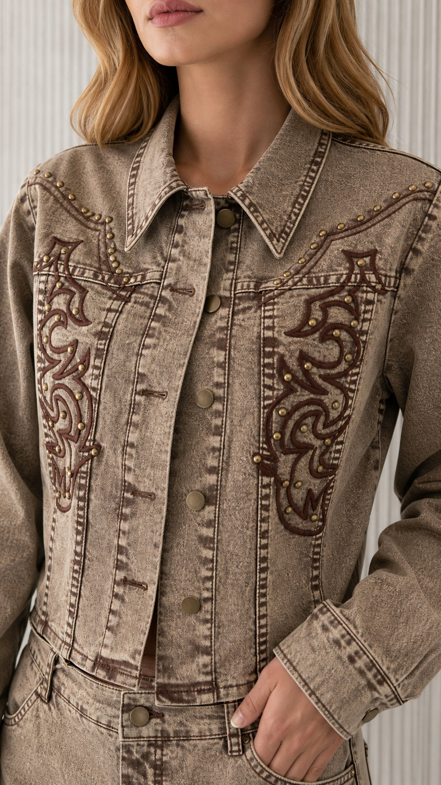 Close-up of khaki denim jacket collar and chest embroidery detail